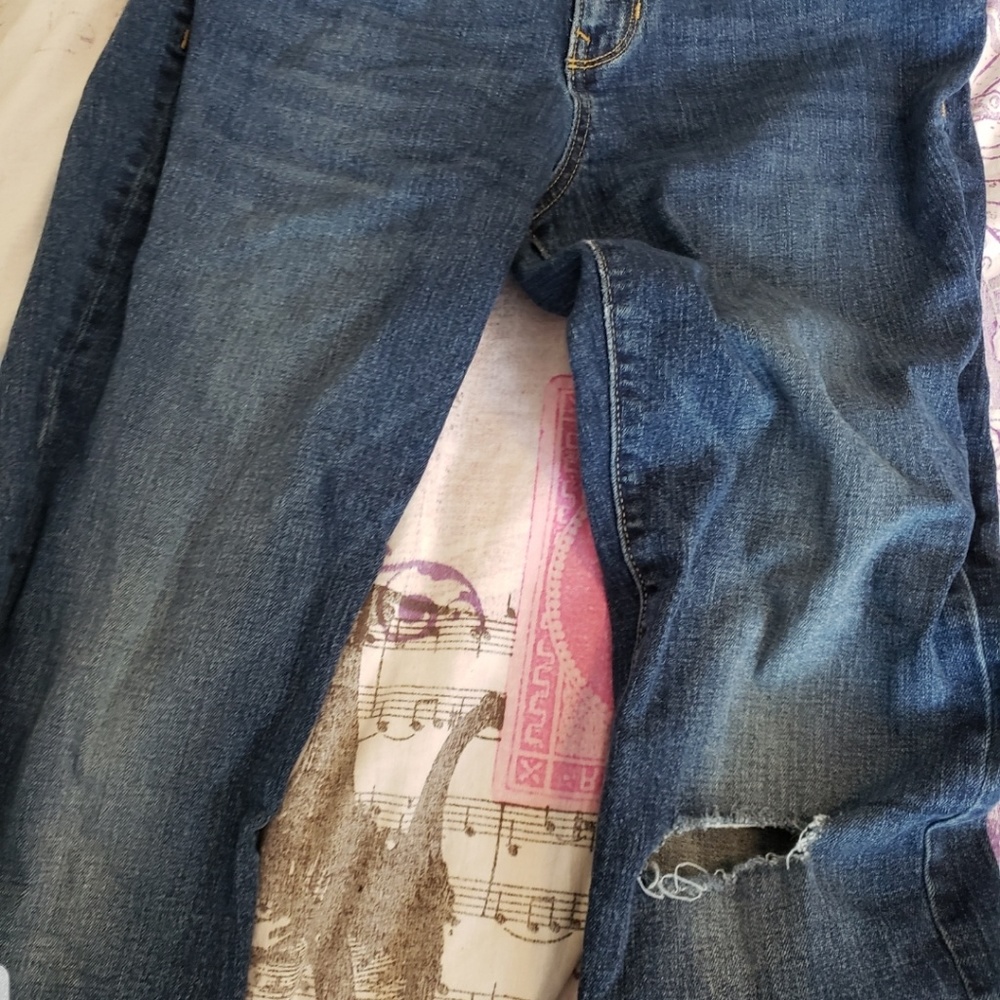 A pair of ripped blue jeans